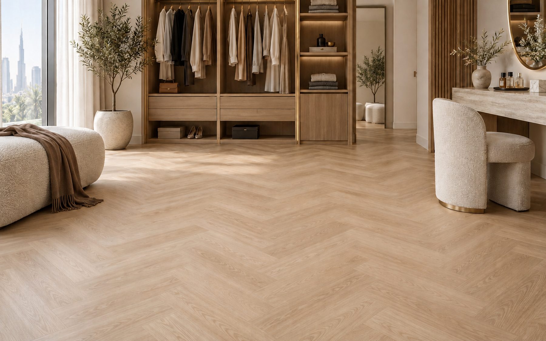 Pale herringbone floor in a serene dressing room with a wardrobe and vanity.